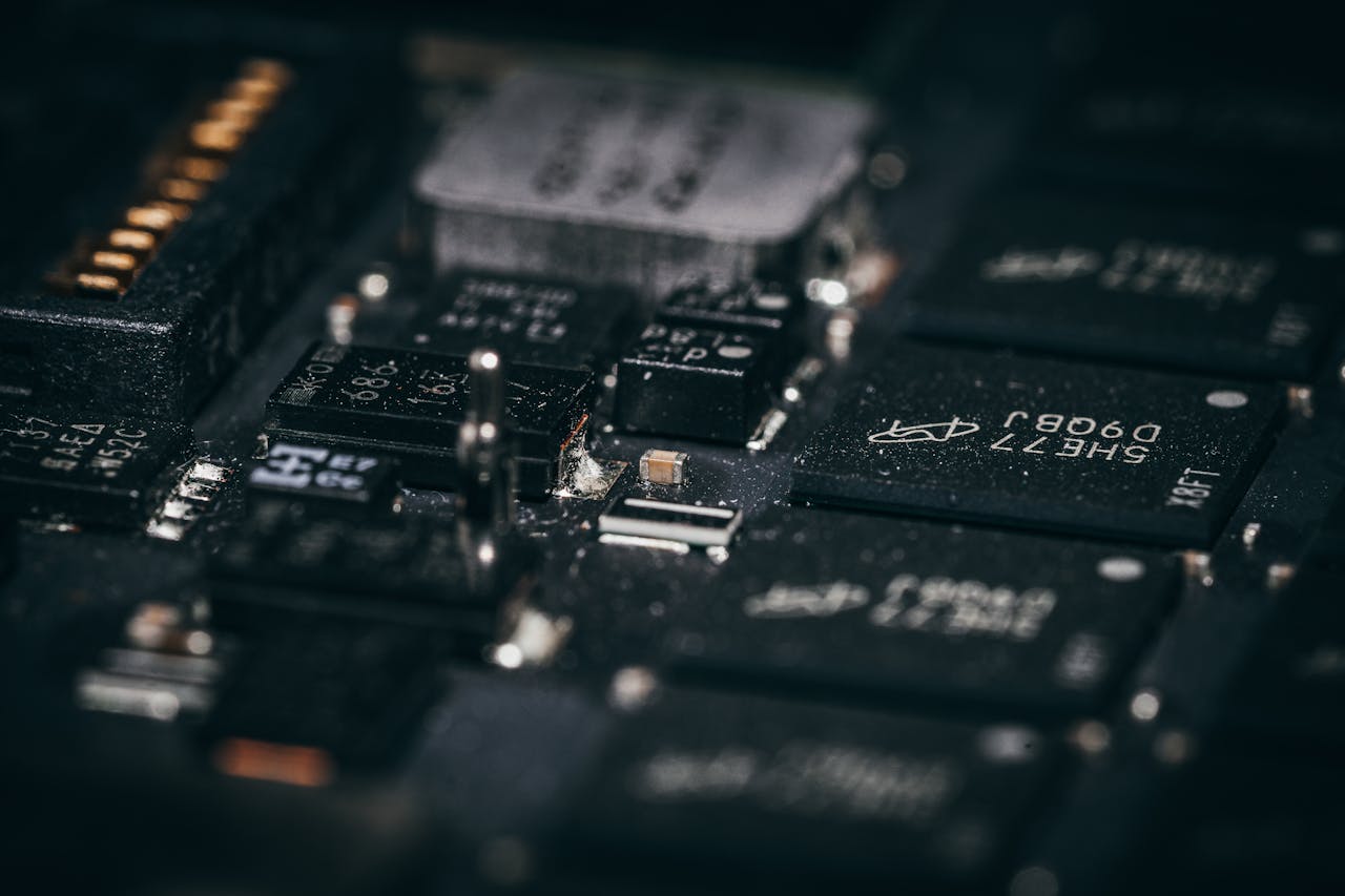 about-01 Detailed macro shot of electronic circuit components showcasing intricate design and layout.